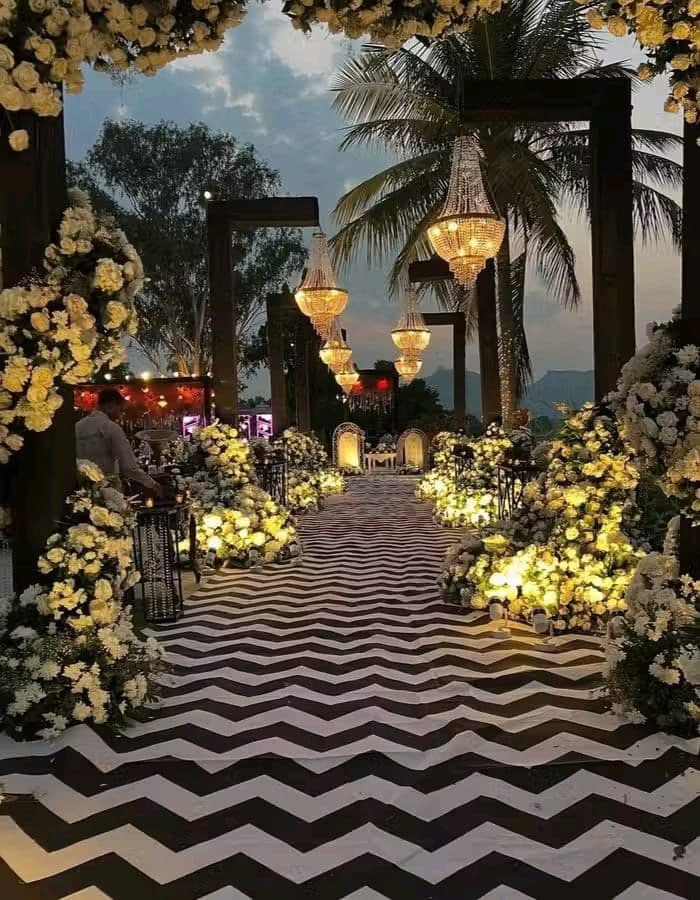 Romantic floral aisle with chandeliers